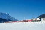 RhB Schnellzug 534 von St.Moritz nach Chur am 26.02.1998 zwischen Celerina und Samedan mit E-Lok Ge 4/4III 649 - B 2382 - WR 3816/17 - A 1264 - A 1266 - B 2494 - B 2357 - B 2347 - D 4226 - BVZ AS