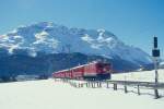 RhB Schnellzug 544 von St.Moritz nach Chur am 26.02.1998 bei Celerina mit E-Lok Ge 6/6II 702 - B - A 1241 - A 1228 - B 2391 - B 2377 - B 2358 - D 4216.