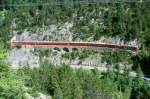 RhB Schnelllzug 545 von Chur nach St.Moritz am 26.08.1998 Ausfahrt Fuegna-Tunnel zwischen Muot und Preda mit E-Lok Ge 4/4III 648 - D - 3x B - 2x A - 2x B - Skl 84xx. Hinweis: gescanntes Dia
