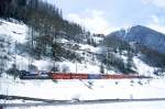 RhB Schnellzug 550 von St.Moritz nach Chur am 11.04.1998 bei Bergn mit E-Lok Ge 4/4 III 644 - B 2253 - B 2436 - WR 3810 - A 1262 - A 1282 - B 2393 - B 2379 - B 2426 - D 4209.