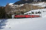 Ge 4/4 I 605 befindet sich am 03.03.2013 mit dem Schlittelzug nach Preda bei Bergn.