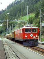 RhB Gterzug 5353 von Landquart nach Pontresina am 03.09.1996 Einfahrt Bergn mit E-Lok Ge 6/6 II 706 - Ge 4/6 353 [berfuhr] - Rw 8247 - Rpw 8234 - Rw 8263 - Uace 7995 - Uahr 8163.