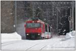 RE1140 mit Ge 4/4 III 651  Fideris  saust ohne Halt durch Spinas. (22.02.2014)