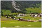 RE1149/GEX902 mit der Ge 4/4 III 645  Tujetsch  auf dem Weg nach St.Moritz oberhalb Bergün. (31.05.2015)