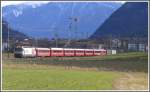 RE1140 aus St.Moritz wird von Ge 4/4 III 641  Maienfeld  gezogen.