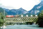 RhB Gterzug 5835 von Landquart nach Thusis am 02.09.1997 auf Rheinbrcke bei Reichenau mit E-Lok Ge 4/4I 601 - Gbkv 5583 - Uce 8084 - Uce 8070 - Uce 8049 - Uce 8018 - P 10053 - Ua 8342 - Ua 8332 - Fad 8738. Hinweis: gescanntes Dia
