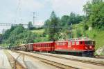 RhB GmP 4537 von Landquart nach St.Moritz am 28.06.1995 Einfahrt Filisur mit E-Lok Ge 6/6II 706 - B 2217 - Gbkv 5543 - Rpw 8273 - X 9040 - Rpw 8226 - Rw 8249 - Rw 8256 - P 10051 - Kk 7090 - Kkw 7375 -