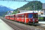 RhB Regionalzug 848 von Chur nach Thusis am 20.06.1998 in Domat Ems mit Steuerwagen voraus ABDt 1711 - B 2417 - B 2416 - Be 4/4 512. Hinweis: gescanntes Dia
