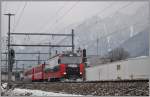 RE1149 mit Ge 4/4 III 648  Susch  in Chur West (16.01.2013)