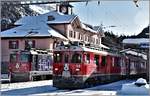 R1936 nach Scuol-Tarasp mit Ge 4/4 II 627  Reichenau-Tamins  und R1636 nach St.Moritz mit ABe 4/4 III 54  Hakone  und 53  Tirano  in Pontresina. (30.11.2019)