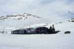RhB Extradampfzug fr Graubnden Tours 3466.1 von km 24,000 nach Ospizio Bernina am 21.02.1998 am Lago Bianco mit Dampflok G 3/4 1 - B 2060 - D 4052 I - A 1102 - Xk 9398. Hinweis: Dampflok Rhtia verkehrte seit bestehen der Berninabahn erst an 3 Tagen auf Ospizio Bernina!
