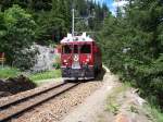 ABe 4/4 52 mit Regionalzug berquert am 11.07.2007 den 2.Bahnbergang unterhalb Cavaglia des Wanderweges Alp Grm - Porschiavo auf seiner Fahrt nach Tirano.