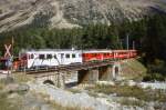 RhB Regionalzug 1650 von Tirano nach St.Moritz am 31.08.2007 auf Brcke in Morteratsch mit Triebwagen ABe 4/4 III 51 - ABe 4/4 III 56 - B 2459 - B 2457 - B 2453 - B 2233 - AB 1545 - BD 2473
