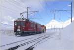 ABe 4/4 II 43 mit Schneerumer 9132 hat seine Arbeit beendet. Vor der Kulisse des Piz Albris warten sie in Ospizio Bernina auf die Rckfahrt. (12.01.2010)
