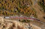 RhB - Bernina-Express 974 von Tirano nach St.Moritz am 12.10.2008 oberhalb Alp Grm mit ABe 4/4 III 51 - ABe 4/4 III 56 - Bp - Bp - Bp - Bps - Ap - Ap. 