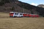 ABe 4/4 III 51 und ABe 4/4 III 55 fahren am 28.3.10 von Privilasco Richtung Poschiavo.
