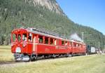 RhB Dampf-Extrazug mit Triebwagenvorspann fr GRUBNDEN TOURS 3413 von Pontresina nach Ospizio Bernina am 26.08.2000 zwischen Surova und Morteratsch bei km 8,900 mit Triebwagen und Dampflok ABe 4/4I 34 - ABe 4/4I 30 - G 3/4 1 - Xk 9398 - B 2060 C 2012. Hinweis: Triebwagen noch in roter Lackierung!
