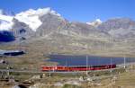 RhB Regionalzug 409 von  St.Moritz nach Tirano am 29.08.1993 am Lago Nero zwischen Bernina Lagalb und Ospizio Bernina mit den Triebwagen ABe 4/4III 56 - BD 2473 - B 2466 - B 2233.