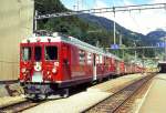 RhB REGIONALZUG 425 von St.Moritz nach Tirano am 28.08.1995 in Poschiavo mit Triebwagen ABe 4/4 42 - ABe 4/4II 43 - BD 2471 - AB 1541 - B 2453 - B 2454 - B 2460 - B 2310 - B 2452.
