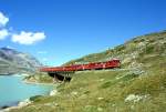 RhB REGIONALZUG 425 von St.Moritz nach Tirano am 04.09.1997 am Lago Biaco auf Brcke am See mit Triebwagen ABe 4/4II 46 - ABe 4/4II 48  - BD 2474 - AB 1546 - B 2309 - AB 1545 - B 2253 - B 2257 - B