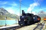 RhB DAMPFZUG fr GRAUBNDEN TOURS 3456 von km 21,700 nach Ospizio Bernina am 26.08.2000 Einfahrt Ospizio Bernina mit Dampflok G 3/4 1 - Xk 9398 - B 2060 - C 2012.