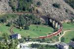 RhB REGIONALZUG 478 von Tirano nach St.Moritz am 29.08.1993 auf Kreisviadukt Brusio mit Triebwagen ABe 4/4III 52 - 3B - A. Hinweis: 300er Teleaufnahme
