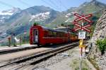  Attenzione!  Bahnbergang an der Station Alp Grm. (Aufnahme 09.07.2010)