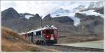 BerninaExpress 976 mit ABe 4/4 III 52  Brusio  mit Cambrenagletscher bei Ospizio Bernina 2253m /M. (11.10.2012)