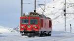 Abgestellte Zweikraftlok Gem 4/4 802  Murmeltier  in der Station Ospizio Bernina. (19.01.2013)