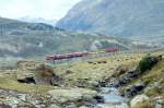 RhB Regionalzug 450 von Tirano nach St.Moritz am 03.09.1993 auf oberer Berninabachbrcke mit Zweikraftlok Gem 4/4 801 - Triebwagen ABe 4/4 III 5x - B - 2x B - B.