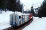 RhB Bergezug 9458 von Montebello nach Pontresina am 06.03.1998 zwischen Montebello und Morteratsch mit Triebwagen ABe 4/4III 54 - Bergetriebwagen Xe 4/4 9920 - Gbkv 5508. Hinweis: Rckansicht, Gbkv 5508 war als letzter Wagen eines Regionalzuges nach Tirano in der Montebello-Kurve entgleist, Eingleisung und Abfuhr des beschdigten Wagens durch Bergetrupp Pontresina, gescanntes Dia
