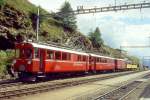 RhB Aussichtswagen-Extrazug 3962 fr RHTIA TOURS von Alp Grm nach Pontresina am 30.08.1996 in Alp Grm mit Triebwagen ABe 4/4 I 34 - ABe 4/4 I 30 - D 4035 - B 2093 - B 2097. Hinweis: Die beiden Triebwagen sind inzwischen in gelb umlackiert, gescanntes Dia.
