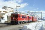 RhB Regionalzug 464 von Tirano nach St.Moritz am 09.03.1998 Einfahrt Alp Grm mit Triebwagen ABe 4/4 III 51 - B 2460 - B 2462 - AB 1546 - B.
