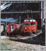 Gem 4/4 801 verlsst elektrisch mit dem Gegenzug den Bahnhof Alp Grm Richtung Tirano.