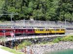 RE 1642 Tirano - St.Moritz mit ABe 4/4 56 und ABe4 30 und 34 am 15.07.3007 am Lago di Poschiavo kurz hinter der Station Miralago.