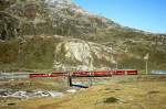 RhB Schnellzug 417 von St.Moritz nach Tirano am 11.10.1999 auf oberer Berninabachbrcke mit Triebwagen ABe 4/4 III 53 - AB 1543 - B 2462 - B 2461 - B 2464.