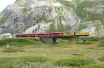 RhB - Regio-Express 1642 von Tirano nach St.Moritz am 17.08.2007 auf Brcke bei Bernina Lagalb mit Triebwagen ABe 4/4 III 54 - B 2253 - B 2456 - B2454 - B 2096 - B 2097  