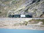 RhB Dampf-Extrazug fr GRUBNDEN TOURS 3423 von Ospizio Bernina nach km 25,000 am 26.08.2000 am Lago Bianco mit Dampflok G 3/4 1 - Xk 9398 - B 2060 C 2012. Hinweis: dies ist der 3. Dampfzugeinsatz auf der Berninalinie seit Bahnbau! Blick ber den See, Teleaufnahme freihand, Entfernung 450m!  
