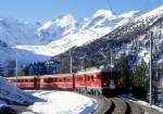 RhB Regionalzug 415 von St.Moritz nach Tirano am 28.02.1998 in der Montebello-Kurve mit Triebwagen ABe 4/4III 54 -BD 2474 - AB 1545 - B 2307 - B 2308 - B 2453.