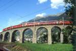 RhB REGIONALZUG 431 von St.Moritz nach Tirano am 30.08.1993 bei Brusio auf Kreisviadukt mit Triebwagen ABe 4/4II 47 - B 2451- AB 1545 - B 2473 - B 2307.
