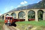 RhB REGIONALZUG 431 von St.Moritz nach Tirano am 30.08.1993 bei Brusio Ausfahrt Kreisviadukt mit Triebwagen ABe 4/4II 47 - B 2451- AB 1545 - B 2473 - B 2307.
