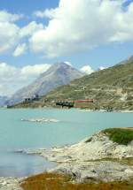 RhB GmP 4435 von St.Moritz nach Tirano am 04.09.1997 bei Ospizio Bernina auf Brcke am See mit Zweikraftlok Gem 4/4 802 - Triebwagen ABe 4/4III 56 - B 2313 - Rw 8290 - Kk 7361 - Kk 7346 - Kk 7345 - Kk