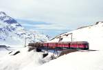 RhB GmP 4435 von St.Moritz nach Tirano am 21.02.1998 bei Ospizio Bernina auf Brcke am See Triebwagen ABe 4/4III 52 - ABe 4/4III 53 - B 2313 - D 4035 - Kkp 7355 - Kkp 7351 - Kkp 7350 - Rpw 8272.
