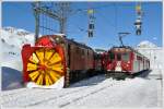 Ospizio Bernina 2253m /M. ist erreicht. X rot d9213 mit Gem 4/4 802 und ABe 4/4 II 49 und 47 mit Rumer 9132. (26.02.2011)