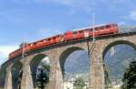 RhB Regionalzug 460 von Tirano nach St.Moritz am 21.08.1991 auf Kreisviadukt bei Brusio mit Triebwagen ABe 4/4II 47 - AB 154x - B. Hinweis: gescanntes Dia
