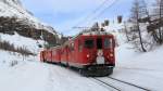 Schnee-Rumer-Zug bestehend aus ABe 4/4 46 + 47 und dem Schnee-Rumer Xk 9132 kurz vor Alp Grm. (19.01.2013)
