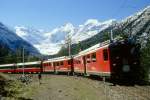 RhB Bernina-Express A 501 von Chur nach Tirano am 08.10.1999 in der Montebello-Kurve oberhalb Morteratsch mit Triebwagen ABe 4/4 II 41 - ABe 4/4 II 43 - A 1275 - A 1274 - B 2496 - B 2492 - B 2491 - B