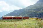 RhB Aussichtswagen-Extrazug 3962 fr RHTIA TOURS von Alp Grm nach Pontresina am 30.08.1996 in der Einfahrtskurve Alp Grm mit Triebwagen ABe 4/4 I 34 - ABe 4/4 I 30 - D 4035 - B 2093 - B 2097.