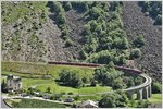 BEX973 mit ABe 4/4 III 55  Diavolezza  und 53  Brusio  auf dem Kehrviadukt von Brusio.