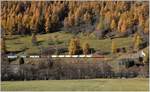 GZ mit Ge 6/6 II 707  Scuol  mit Wagen für Lebensmittel auf der Rückfahrt nach Landquart bei Susch. (31.10.2017)